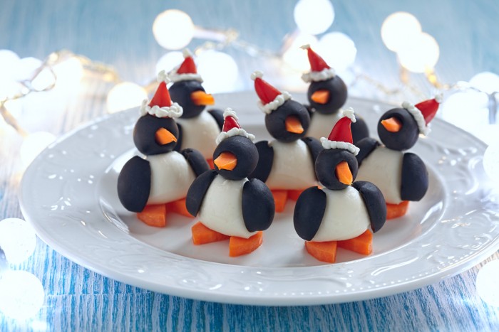 olive penguins snack with mozzarella, carrot and pepper santa hat