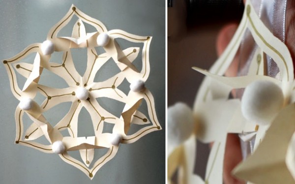 Copos de nieve - Kirigami están decorados con lindos pomponchiki, diamantes de imitación o bolas de lana