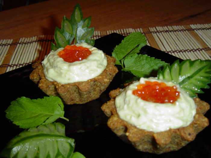 Tartlets with caviar and avocado