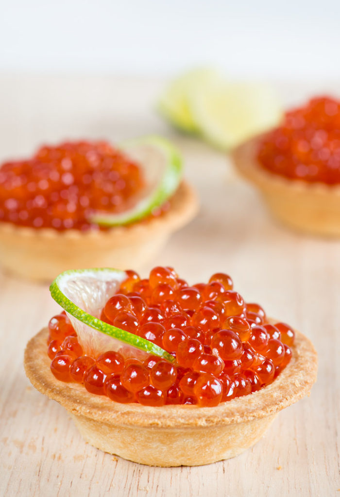 Bright tartlets for a buffet with caviar, shaped lime