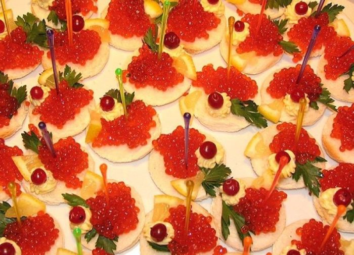 Fucking canapes for a buffet with caviar, oil and lemon