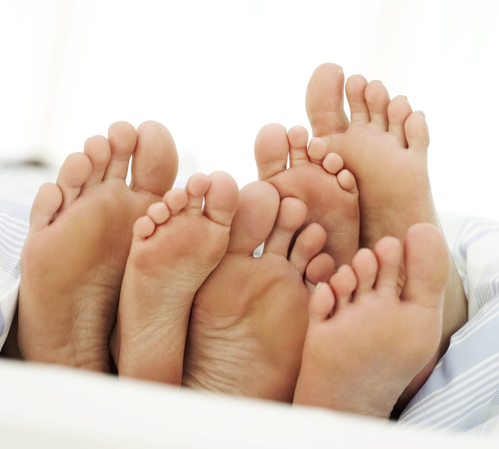 Soles of a Couple and Their Child