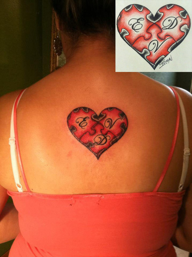 heart-puzzle-tattoo-on-upper-back